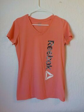 Reebok Orange Sport Top Women size Small Tshirt Short Sleeve Spell Out Camo Logo
